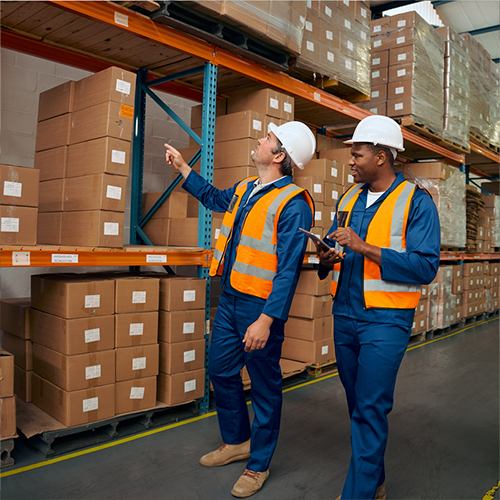 a group of men in a warehouse